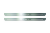 Two long silver-finished door sill plates with XC60 lettering on a light background, straight-on view.