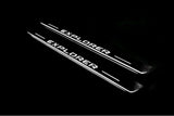 Ford Explorer V 2011+ LED door sill plates in stainless steel with Explorer logo