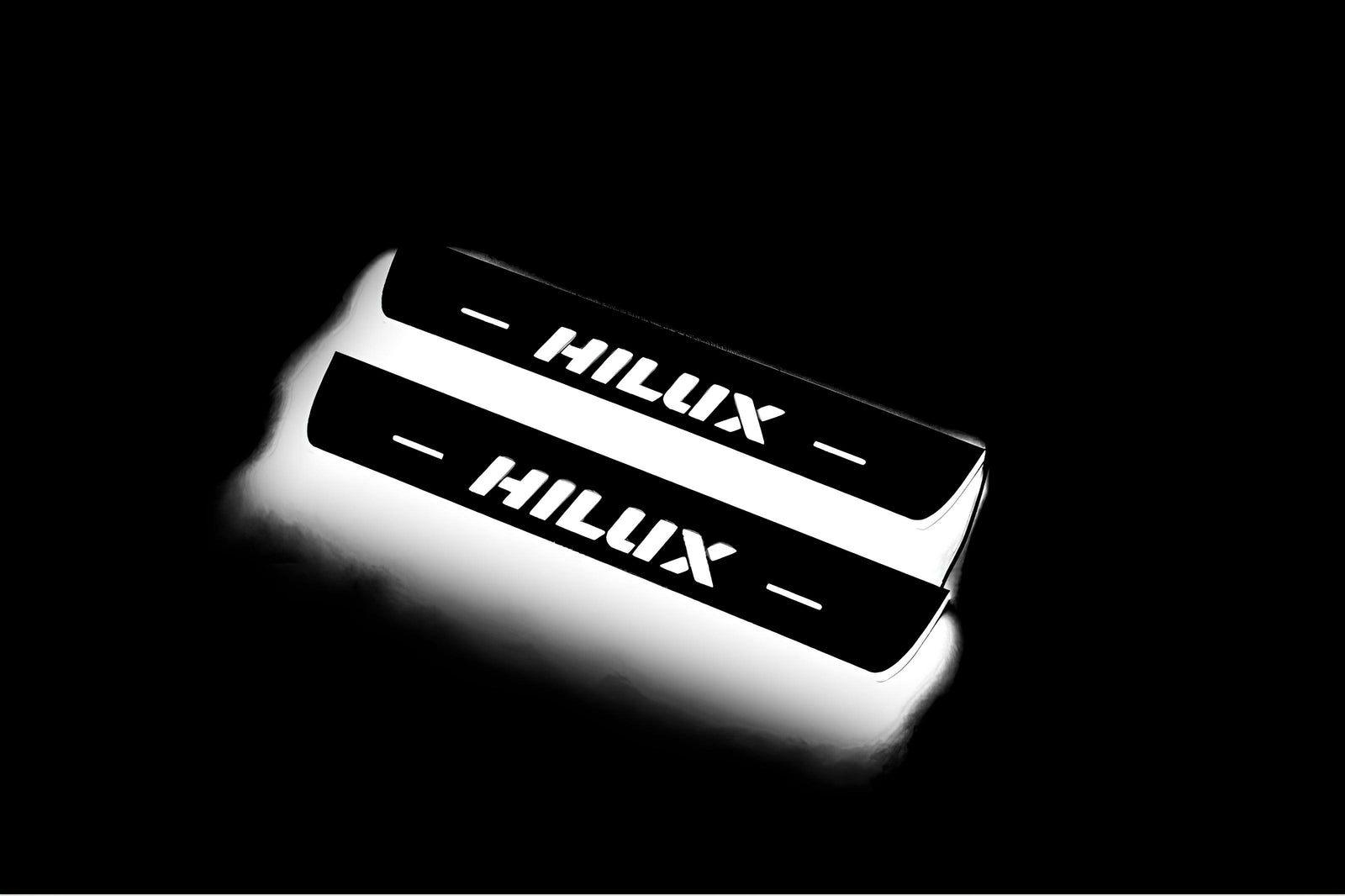 Toyota Hilux VIII 2015+ stainless steel LED door sill plates with Hilux logo