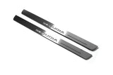 Two short silver-finished door sill plates with Sequoia lettering on a light background, angled view.