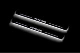 Ford Focus II 2004+ LED door sill plates in stainless steel with Focus logo