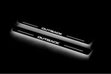 Two long door sill plates with Outback lettering and edges illuminated in white, angled view on a dark background.