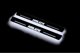 Toyota Hilux VIII 2015+ LED door sill plates with Hilux logo