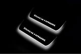 Jeep Grand Cherokee IV WK2 2010+ LED door sill plates stainless steel with TrackHawk logo