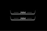 Two long door sill plates with 3008 lettering and edges illuminated in white, straight-on view on a dark background.