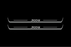 Two long door sill plates with 3008 lettering and edges illuminated in white, straight-on view on a dark background.