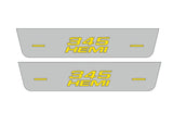 Catalog illustration of two short gray door sill plates with yellow 345 lettering stacked over HEMI with horizontal lines on a white background.