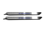 Two narrow silver door sill inserts with blue M Performance lettering and attached wires, straight-on view on a white background.