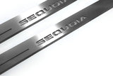 Close-up of Sequoia lettering and linear slots in silver-finished door sill plates.