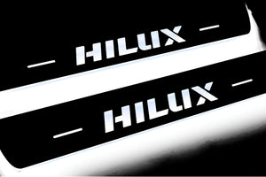 Illuminated LED Door Sill Tread Plates Toyota Hilux VIII 2015+ With Hilux Logo Toyota Led Door Sills opdesign