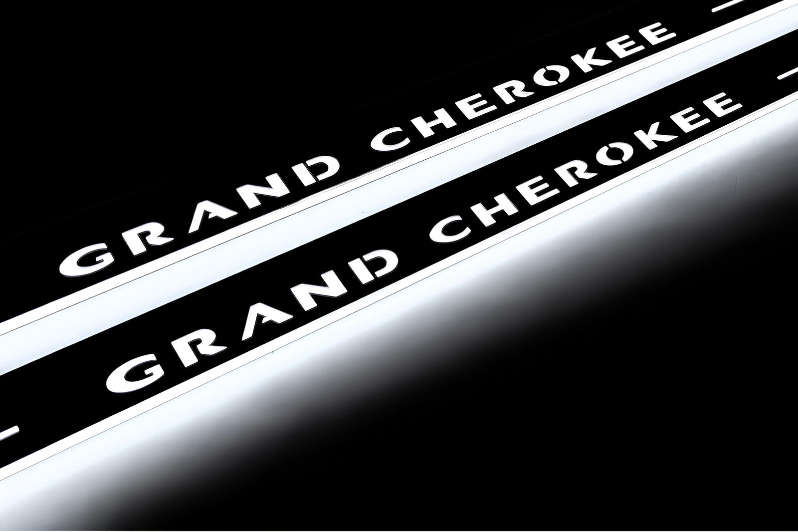 LED door sill plates Jeep Grand Cherokee III WK2 2005+ stainless steel with Grand Cherokee logo