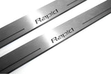 Close-up of Rapid lettering and linear slots in silver-finished door sill plates.