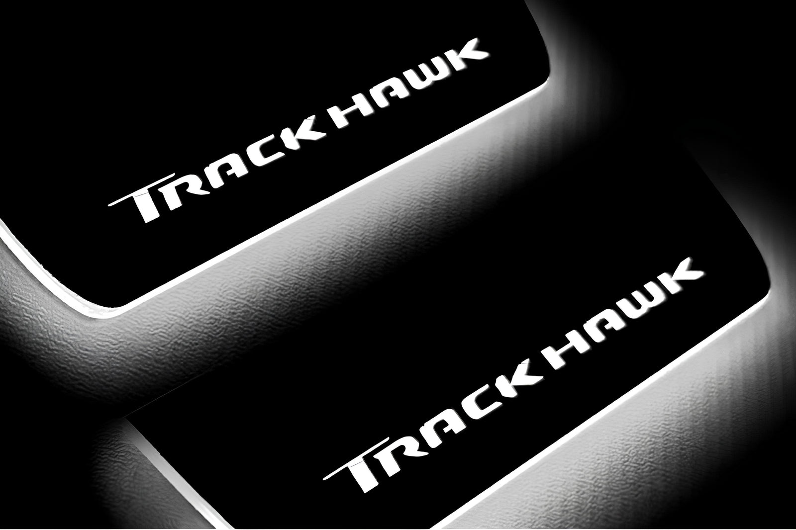 Jeep Grand Cherokee IV WK2 2010+ illuminated entry guards in stainless steel with TrackHawk logo