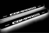 Jeep Compass II 2016+ illuminated entry guards in stainless steel with Compass logo