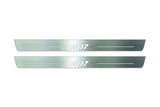 Two long silver-finished door sill plates with 407 lettering on a light background, straight-on view.