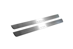 Two long silver-finished door sill plates with 300 S lettering on a light background, angled view.