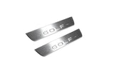 Two short silver-finished door sill plates with Golf lettering on a light background, angled view.