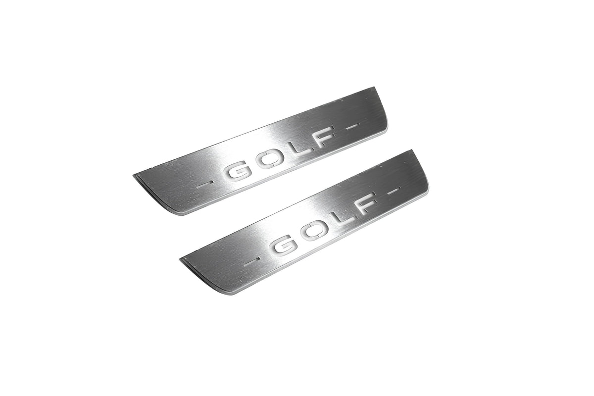 Two short silver-finished door sill plates with Golf lettering on a light background, angled view.