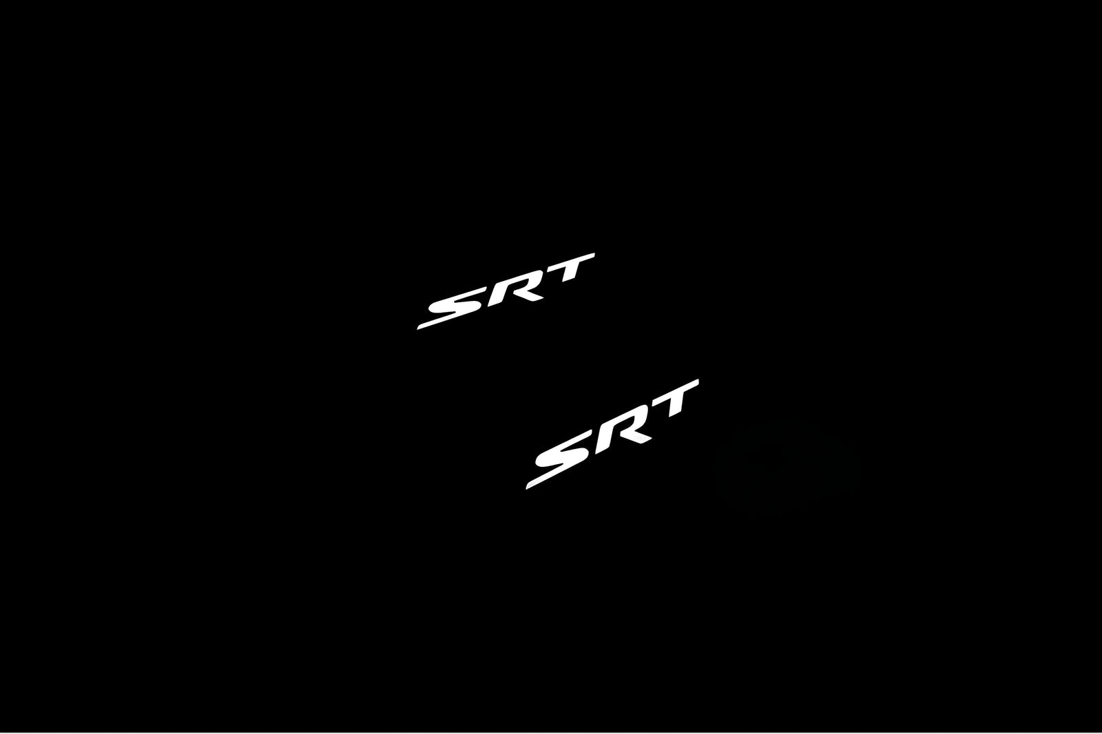 Dodge Durango III 2011+ door sill plates in matte black coated stainless steel with SRT logo