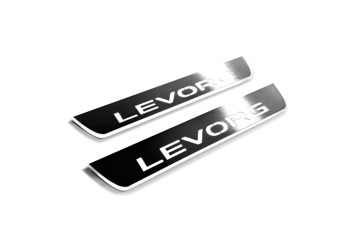 Two short silver-finished door sill plates with Levorg lettering on a light background, angled view.