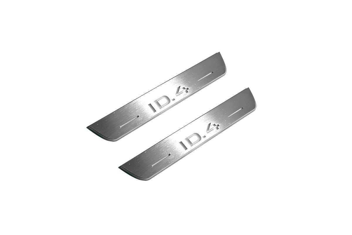 Two short silver-finished door sill plates with ID.4 lettering on a light background, angled view.