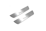 Two short silver-finished door sill plates with Yeti lettering on a light background, angled view.