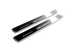 Two long silver-finished door sill plates with Accent lettering on a light background, angled view.