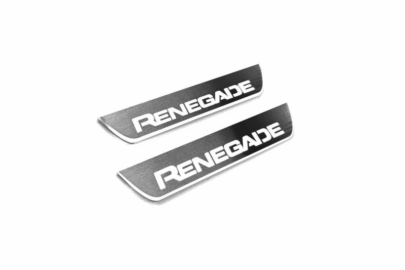 Two short gray-faced door sill plates with white Renegade lettering and silver edges on a light background, angled view.