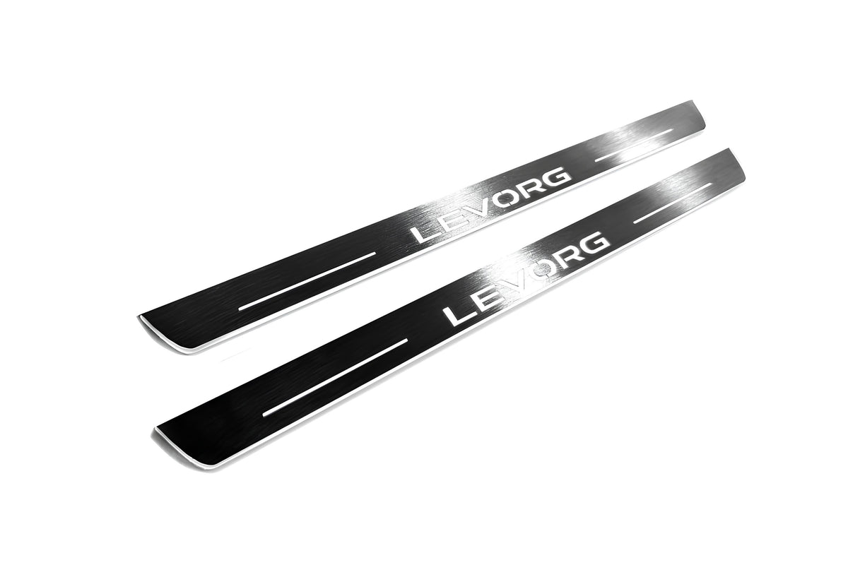 Two long silver-finished door sill plates with Levorg lettering on a light background, angled view.