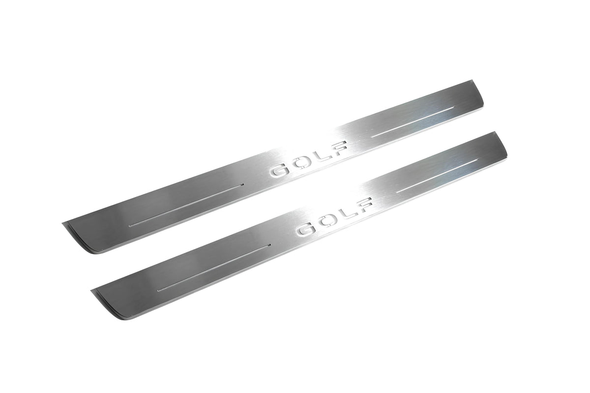 Two long silver-finished door sill plates with Golf lettering on a light background, angled view.