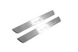 Two long silver-finished door sill plates with Yeti lettering on a light background, angled view.