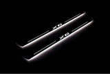 BMW X6 E71 2008+ LED door sill plates in stainless steel with X6 logo