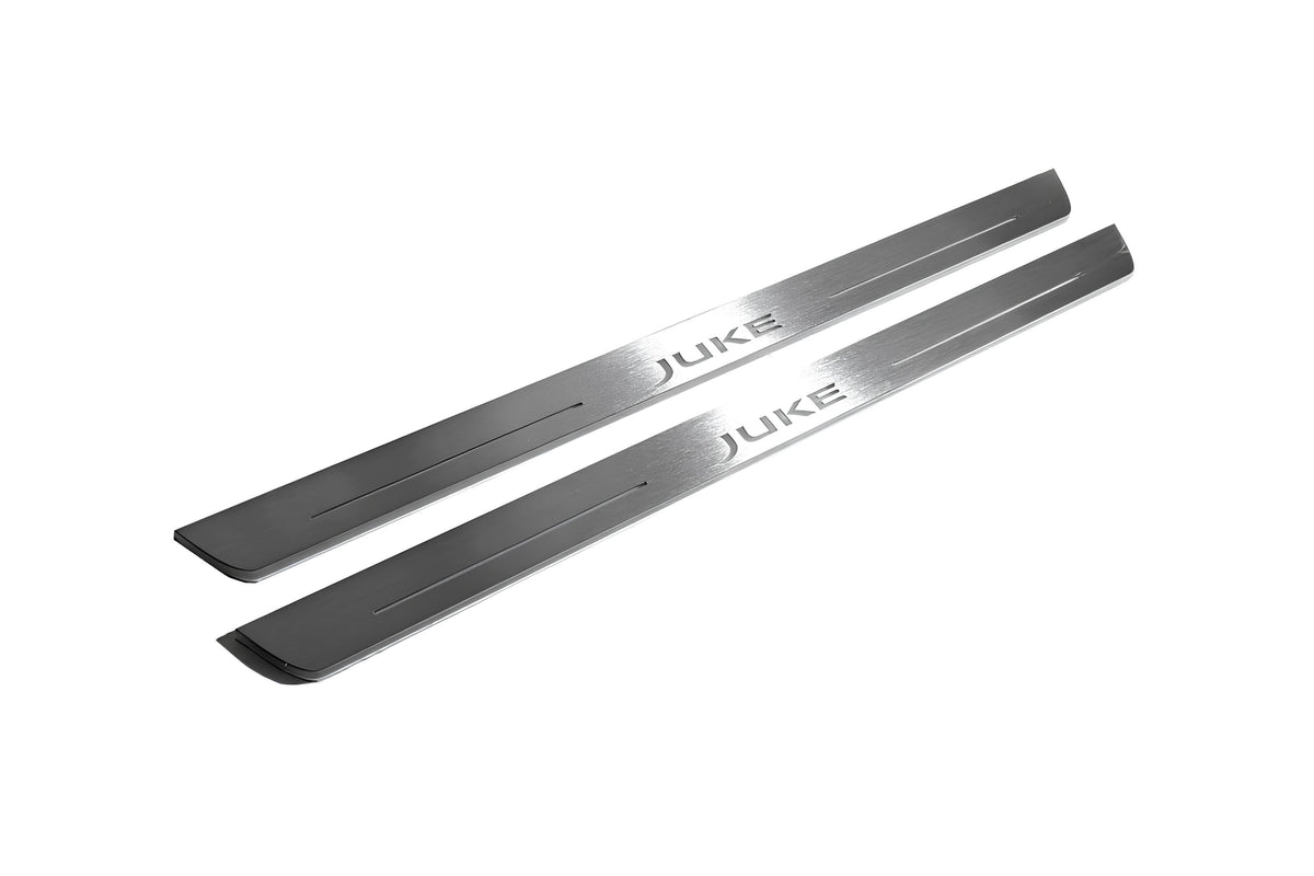 Two long silver-finished door sill plates with Juke lettering on a light background, angled view.