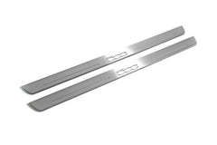 Two long silver-finished door sill plates with 500 lettering on a light background, angled view.