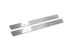 Two long silver-finished door sill plates with Sonata lettering on a light background, angled view.