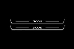 Two long door sill plates with 5008 lettering and edges illuminated in white, straight-on view on a dark background.