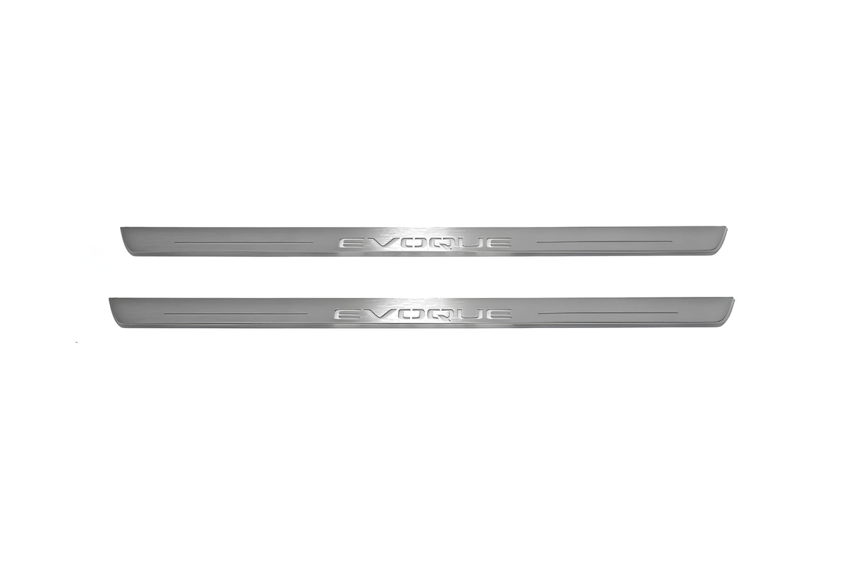 Two long silver-finished door sill plates with Evoque lettering on a light background, straight-on view.