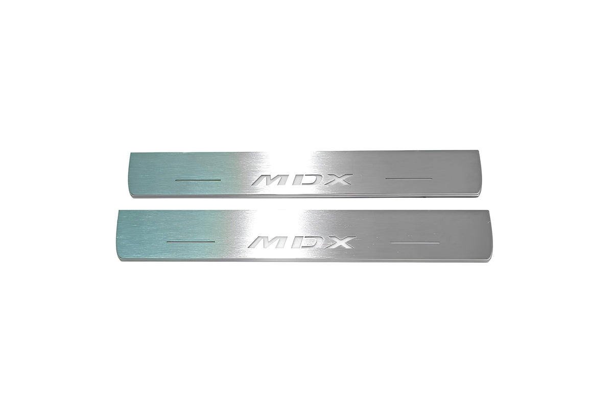 Two short silver-finished door sill plates with MDX lettering on a light background, straight-on view.