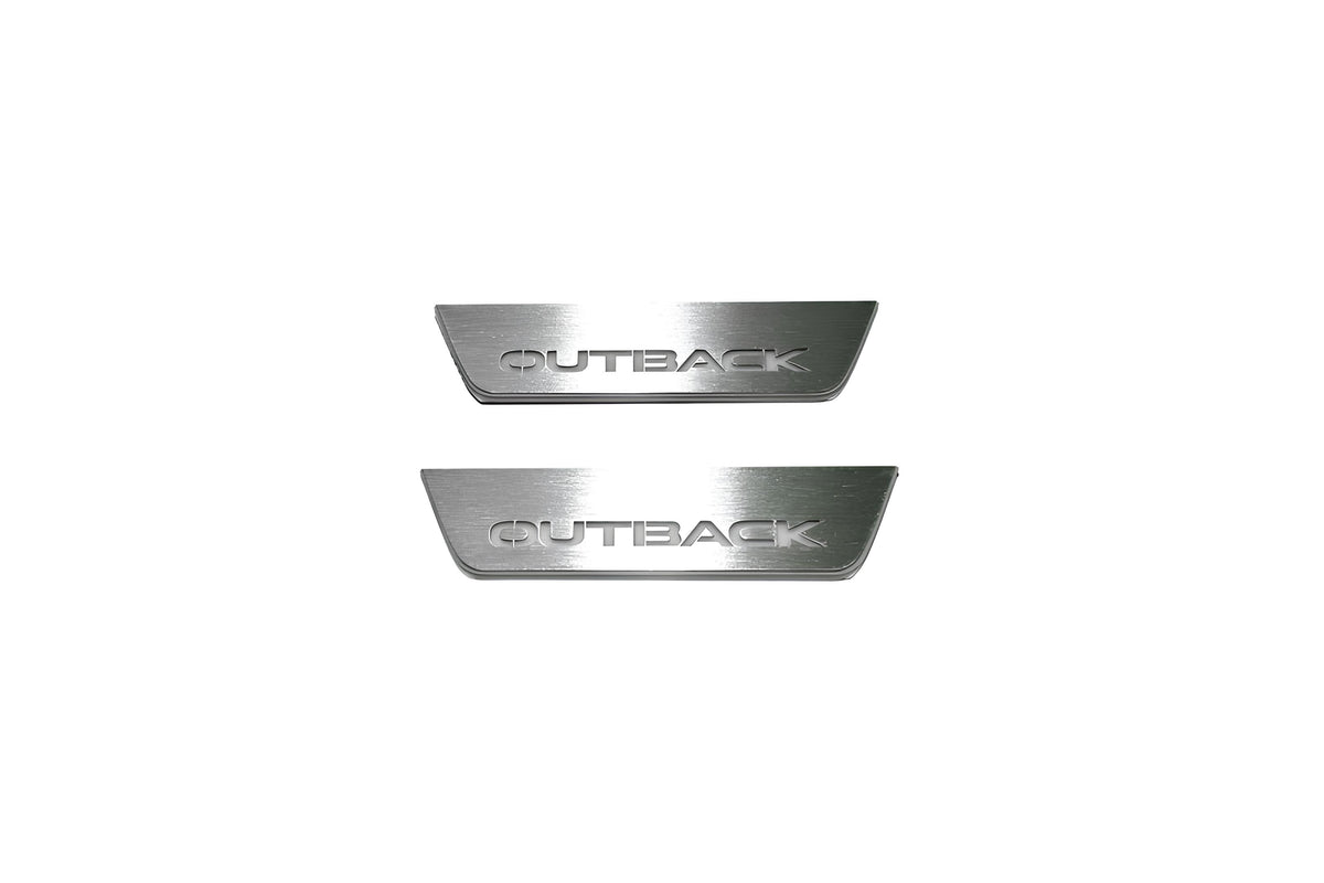 Two short silver-finished door sill plates with Outback lettering on a light background, straight-on view.