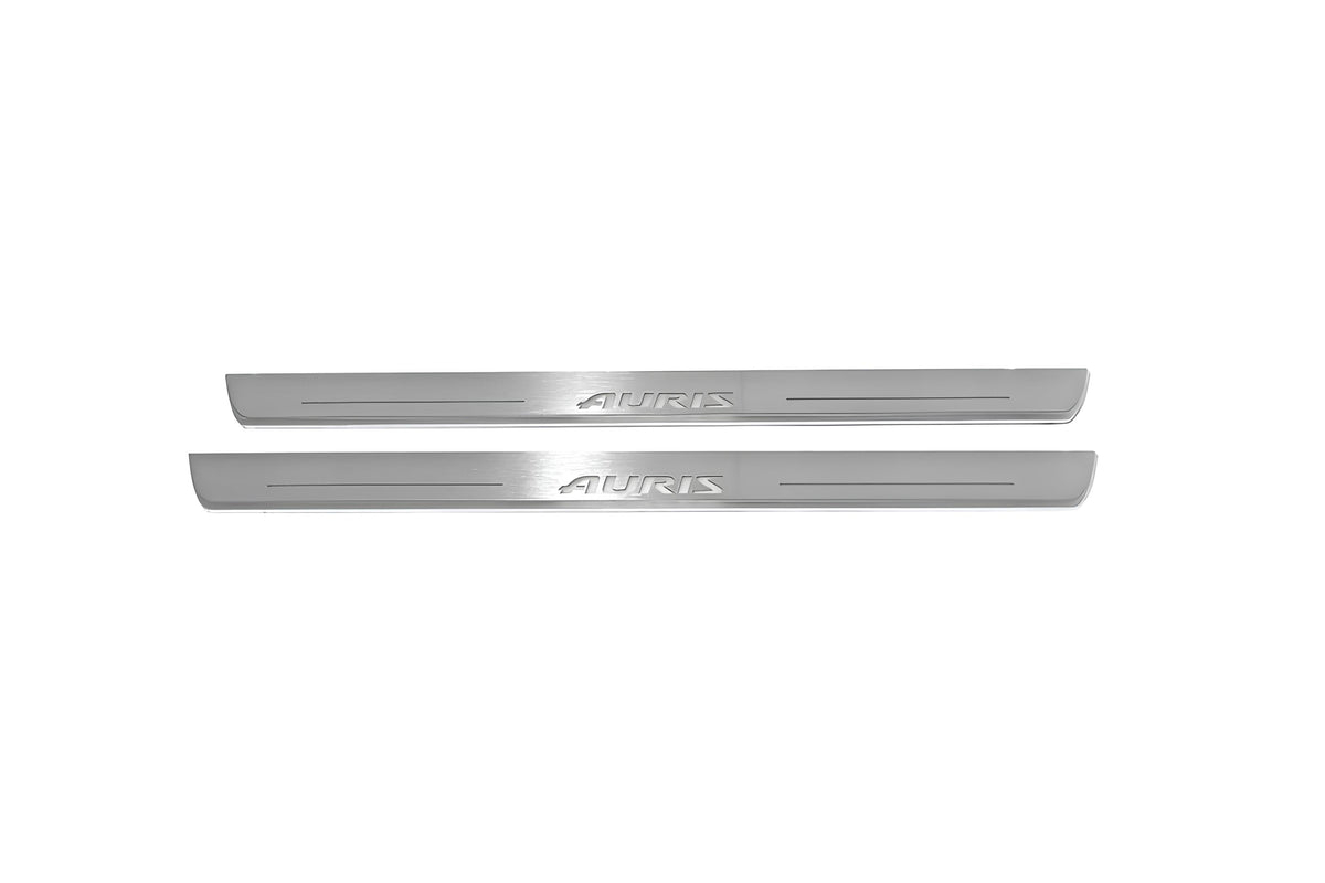 Two long silver-finished door sill plates with Auris lettering on a light background, straight-on view.