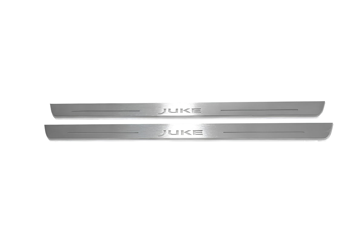 Two long silver-finished door sill plates with Juke lettering on a light background, straight-on view.
