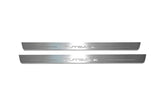 Two long silver-finished door sill plates with Outback lettering on a light background, straight-on view.