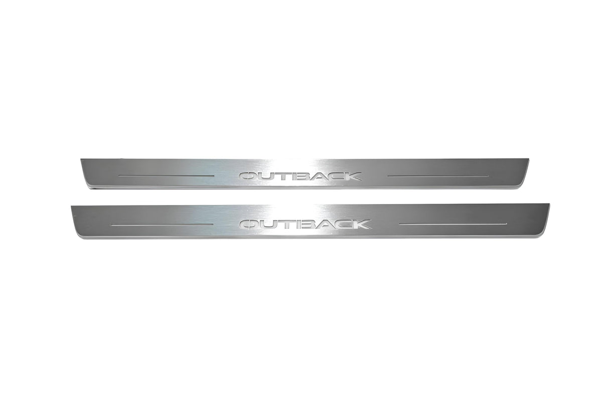 Two long silver-finished door sill plates with Outback lettering on a light background, straight-on view.