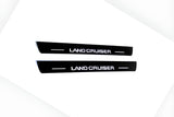 Toyota Prado 250 2023+ stainless steel LED door sill plates with Land Cruiser logo