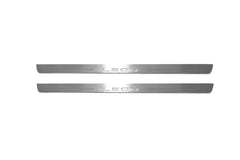 Two long silver-finished door sill plates with Leon lettering on a light background, straight-on view.