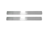 Two long silver-finished door sill plates with MDX lettering on a light background, straight-on view.