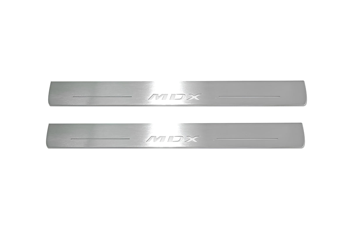Two long silver-finished door sill plates with MDX lettering on a light background, straight-on view.