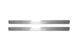 Two long silver-finished door sill plates with Impreza lettering on a light background, straight-on view.