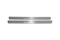Two long silver-finished door sill plates with Discovery lettering on a light background, straight-on view.