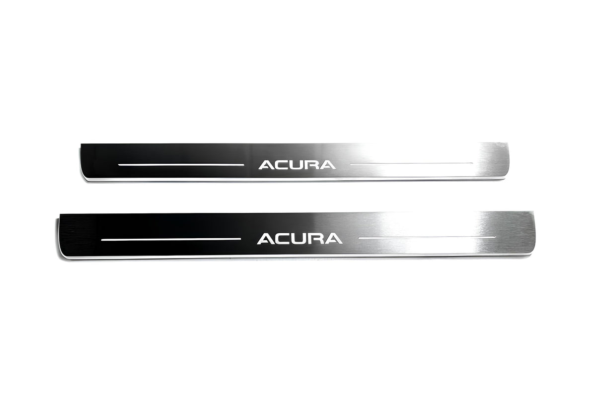 Two long reflective dark door sill plates with white Acura lettering and horizontal lines on a white background, straight-on view.